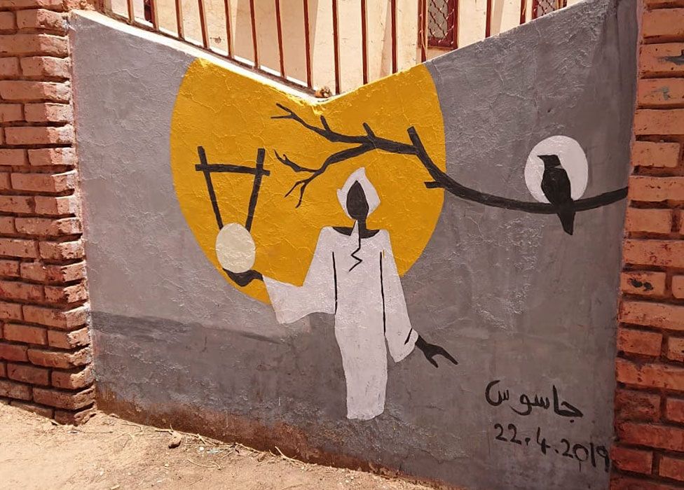 A mural of a man holding a stringed instrument in Khartoum, Sudan