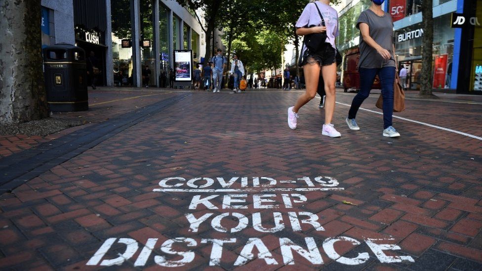 A Covid-19 social distancing public notice on a street in Birmingham