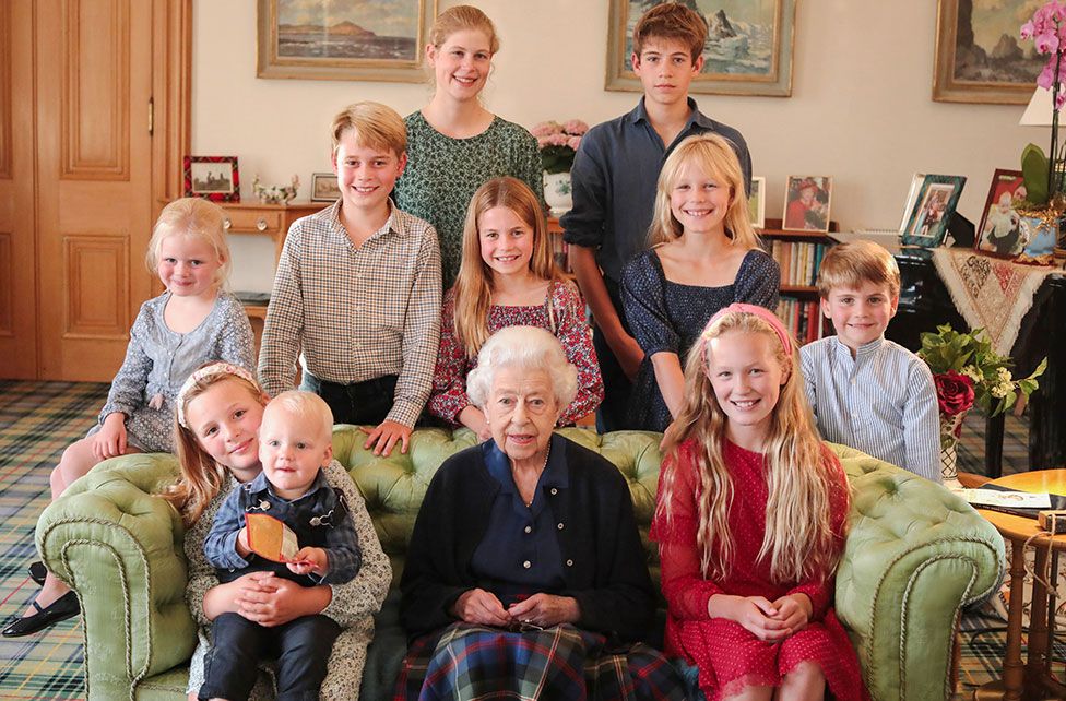 The late Queen with her grandchildren and great-grandchildren
