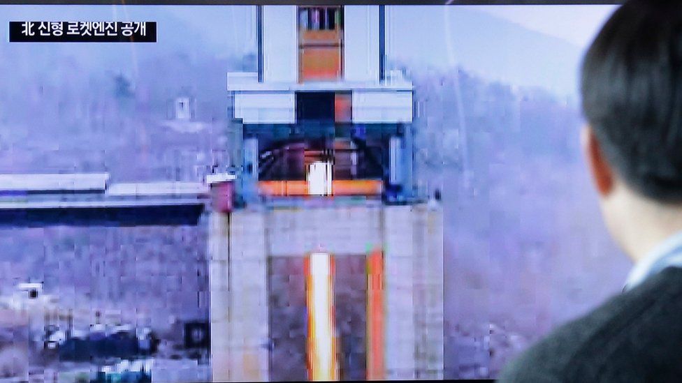 A man watches a TV news program showing an image that North Korea"s Rodong Sinmun newspaper reports of a ground test of a new type of high-thrust rocket engine at Seoul Railway station in Seoul, South Korea, Sunday, March 19, 2017