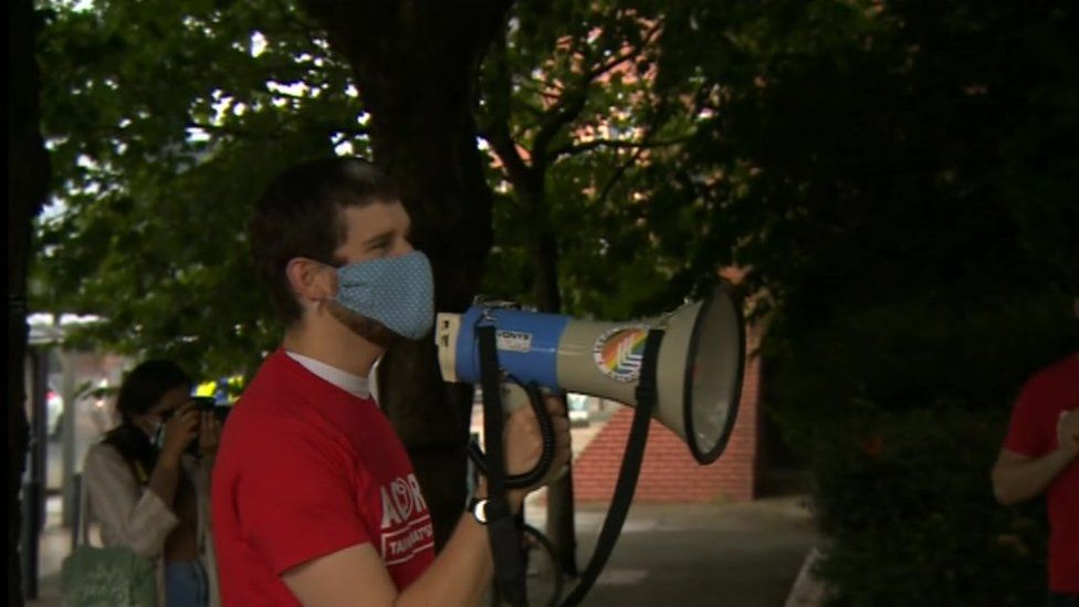 A protester holding a megaphone