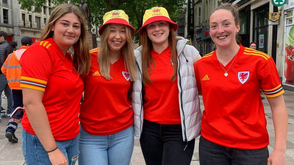Women in Welsh football shirts