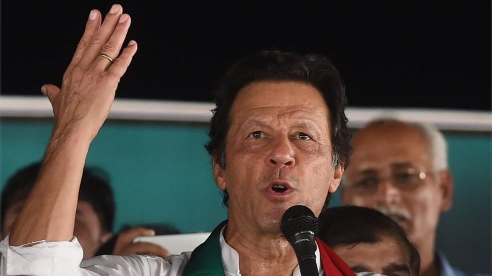 Pakistani cricket star-turned-politician and head of the Pakistan Tehreek-e-Insaf (PTI) Imran Khan gives a speech during a political campaign rally for the upcoming general election in Lahore on July 18, 2018.