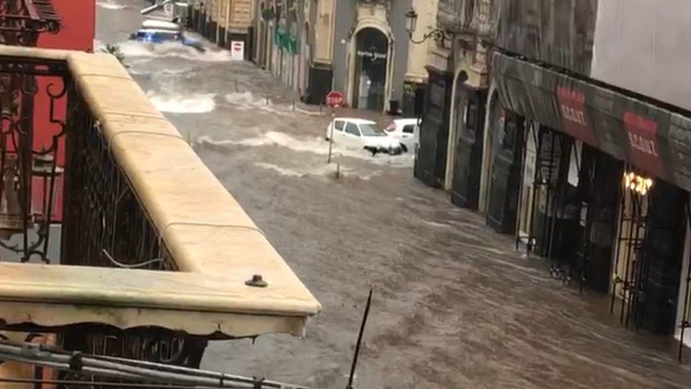 The flood submerges the streets of Catania
