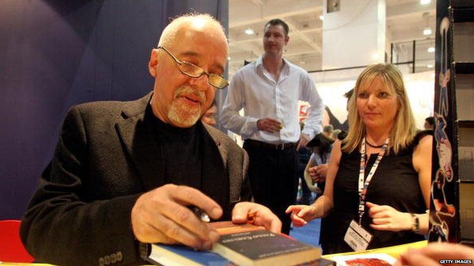 Paulo Coelho signing novels at an event in 2007