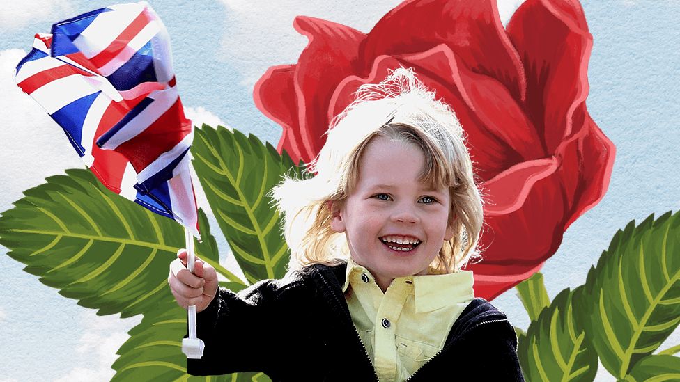 Child holding a Union Jack flag against a mural of a rose