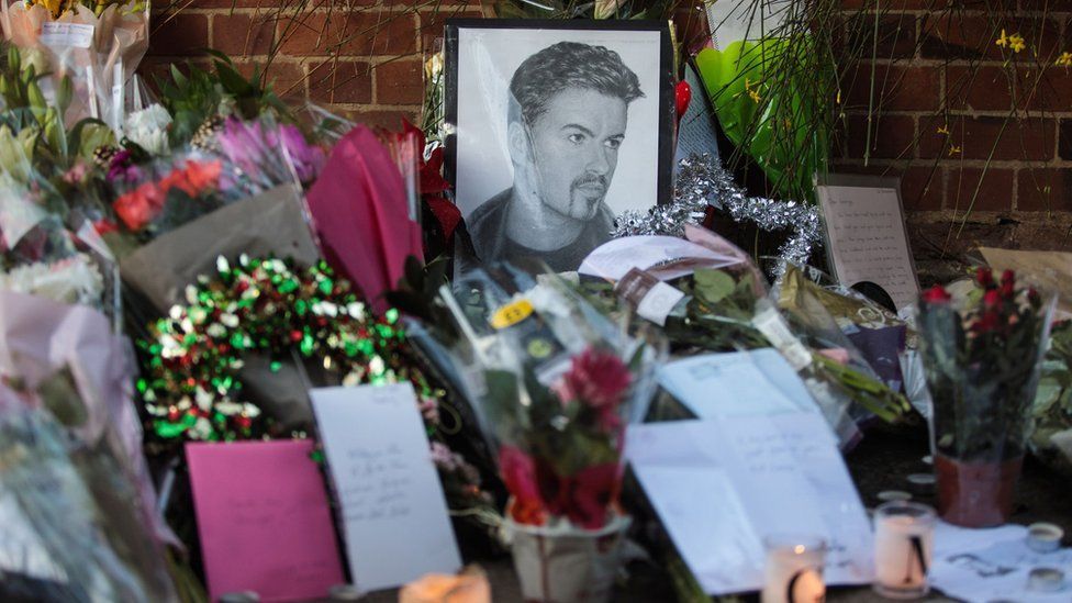 Flowers and tributes laid outside the Oxfordshire home of George Michael