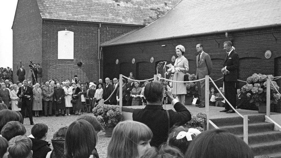 Black and white image of The Queen and Prince Phillip with Benjamin Britten at the opening ceremony of the Maltings Concert Hall and opera house, Suffolk