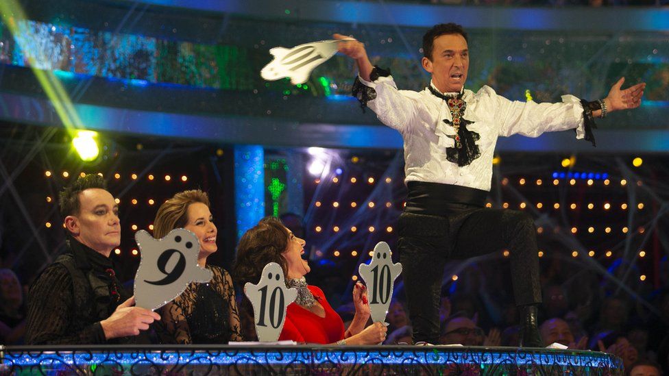 Bruno Tonioli jumping on the judges' desk on Strictly Come Dancing