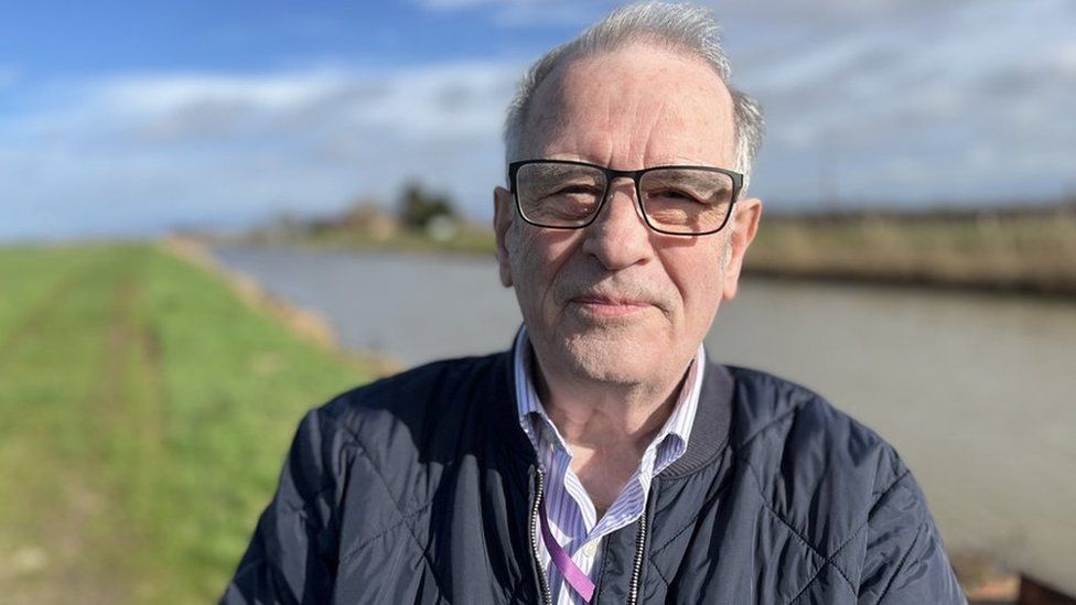 Alex Miscandlon, from Fenland District Council, stood in front of a body of water