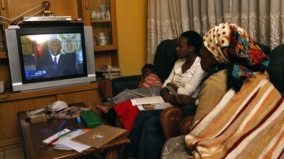 A family watch Thabo Mbeki