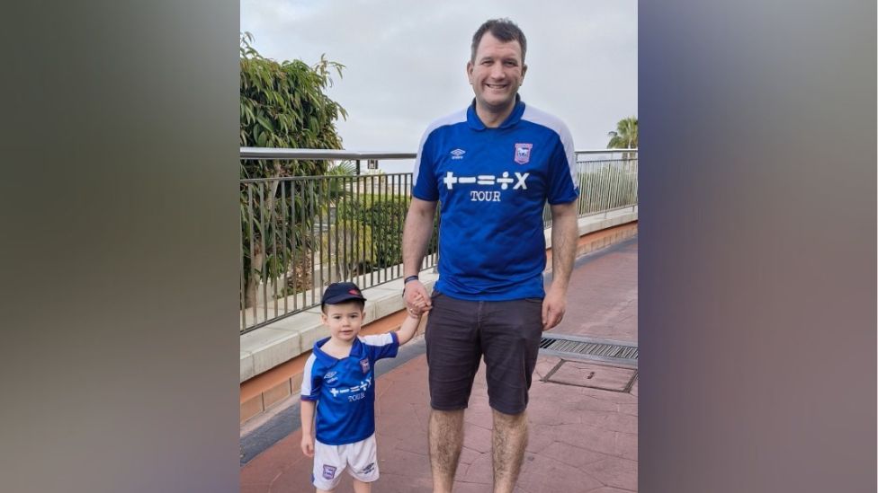 David Moore and one of his sons in their Ipswich Town football kit