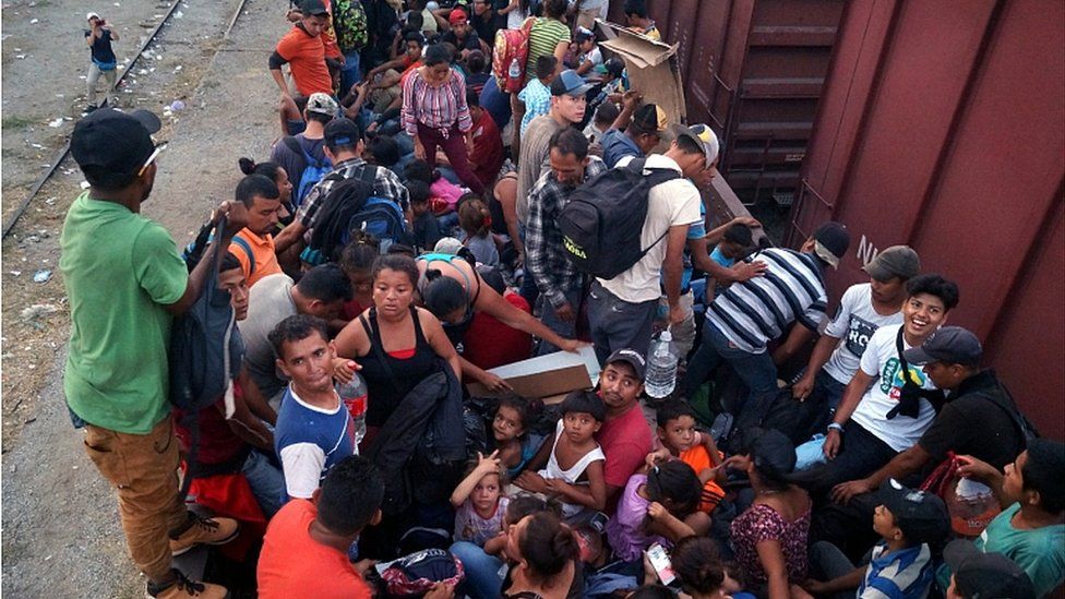 Central American migrants board train wagons in an attempt to make their way to the US border, in the municipality of Arriaga, Chiapas, Mexico, 25 April 2019