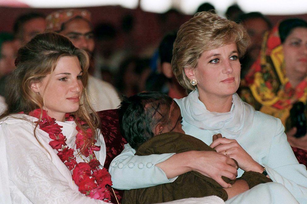 Diana, Princess of Wales wears a traditional shalwar khameez as she sits with Jemima Khan during a visit to Imran Khan's cancer hospital in Lahore, Pakistan in April 1996
