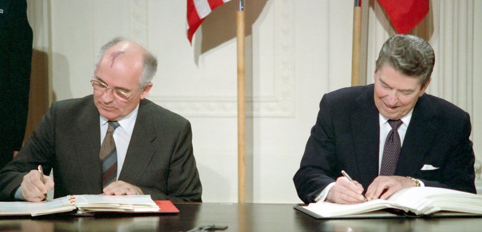 General Secretary Mikhail S. Gorbachev of the Soviet Union and President Ronald Reagan sign the Intermediate-Range Nuclear Forces Treaty at the White House on December 8, 1987.