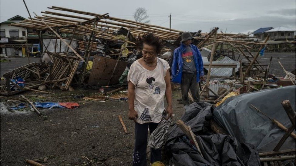 Residents inspect damage in Alcala, Philippines, after Typhoon Mangkhut battered the north, 15 September, 2018