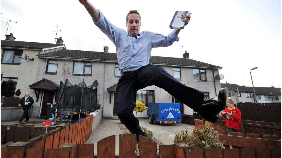 Ian Paisley jumping over a fence