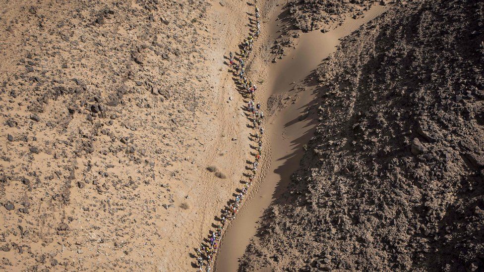Competitors take part in Stage 3 of the 33rd edition of the Marathon des Sables between Rich Mbirika and Nord El Maharch in the southern Moroccan Sahara desert on April 10, 2018.