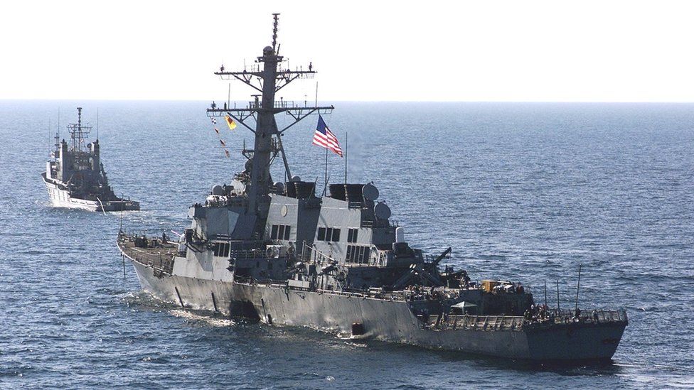 The USS Cole being towed away from Aden after the attack, 29 October 2000