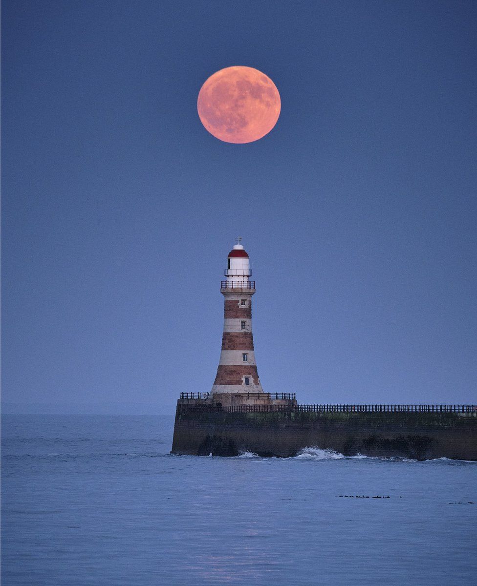 Michael Wake said the Strawberry Moon got brighter and brighter as it rose over Roker Pier in Sunderland