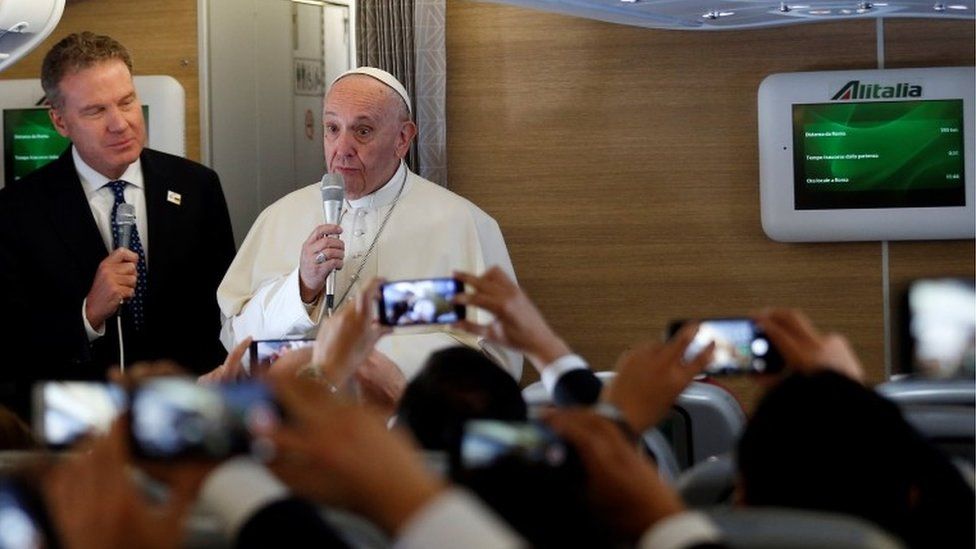Pope Francis speaks with media while on board his plane bound to Bogota, Colombia, September 6, 2017