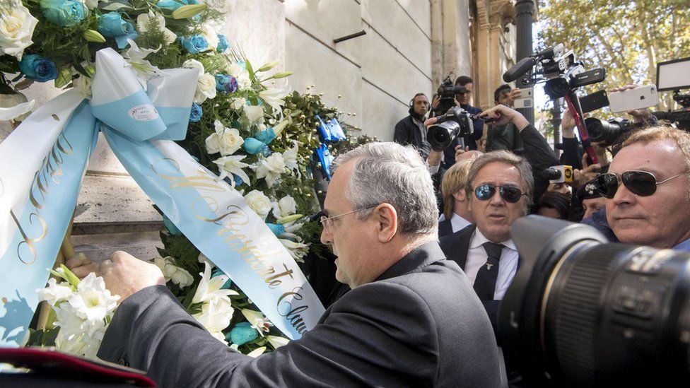 Lazio Chairman Claudio Lotito puts a flower wreath at the synagogue in Rome