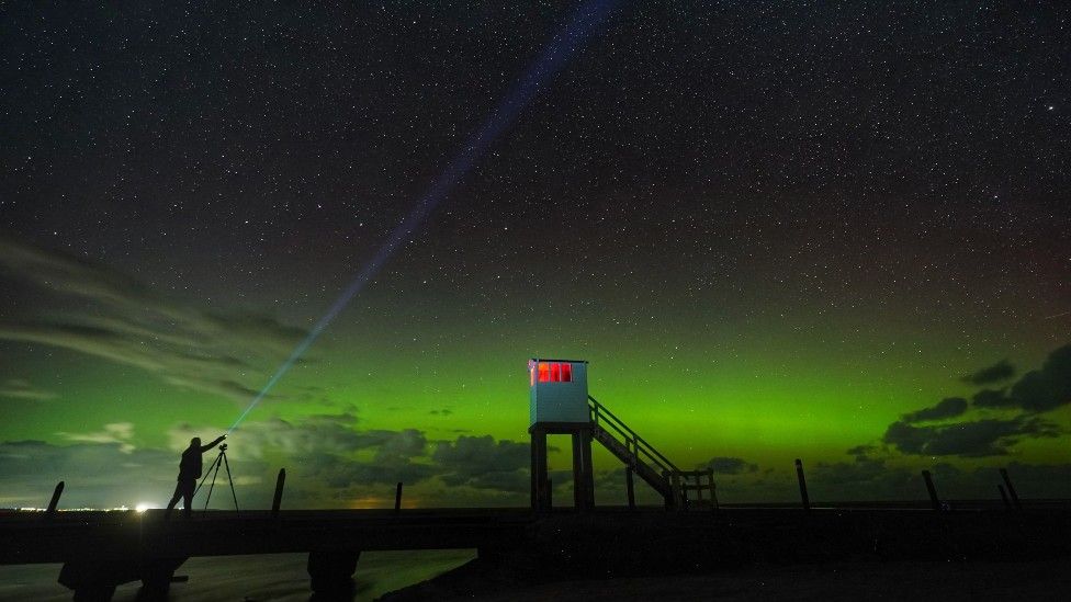 A show of the Northern lights over the refuge hut on the Holy Island causeway in Northumberland
