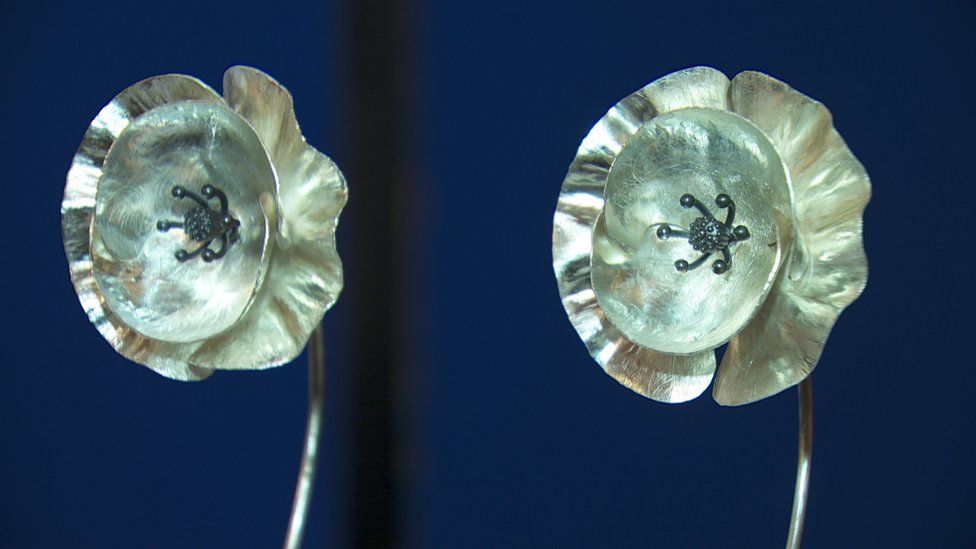 Two silver poppies