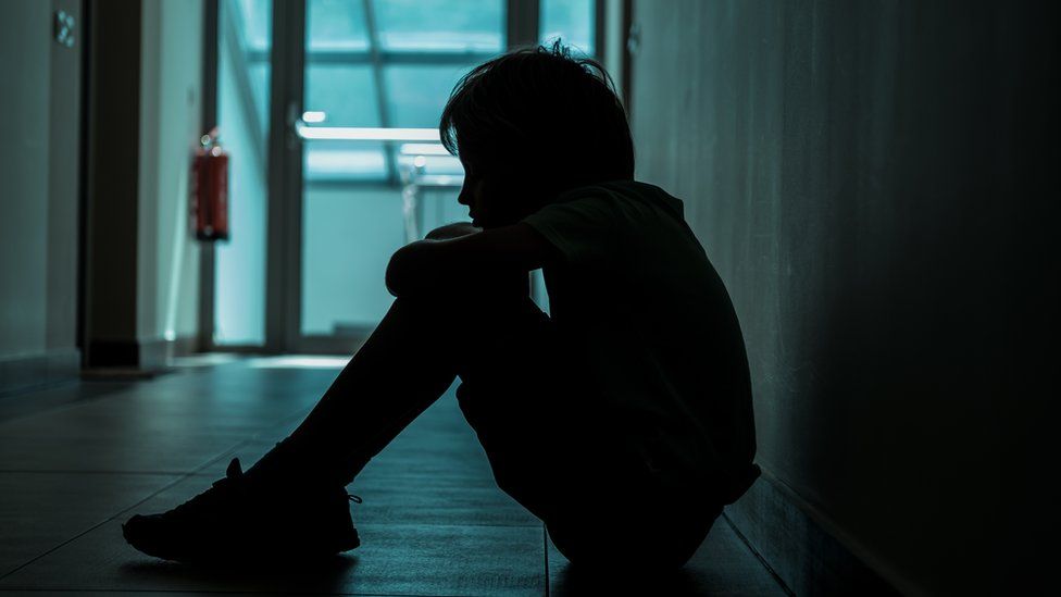 A stock image of a child suffering from mental health struggles