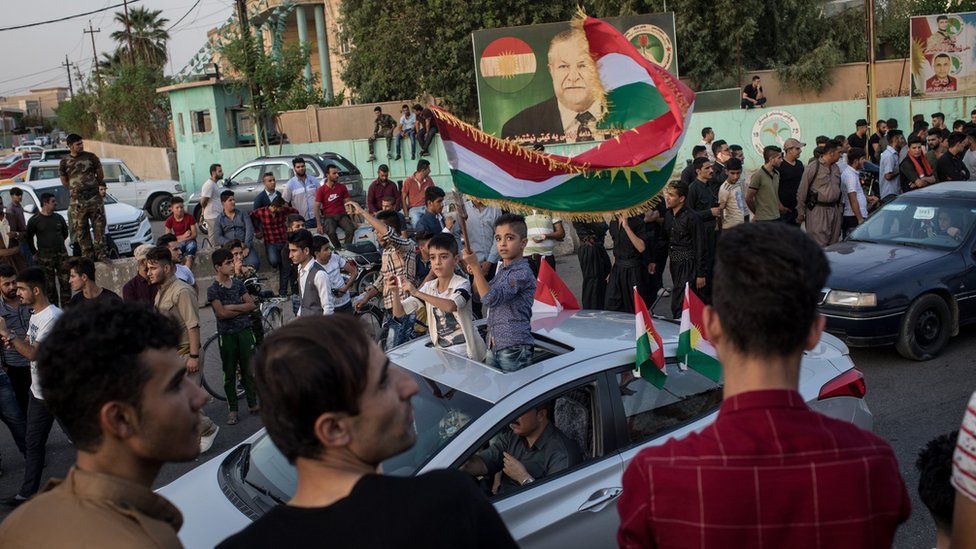 Kurds celebrate on the streets of Kirkuk after voting in an independence referendum on 25 September 2017