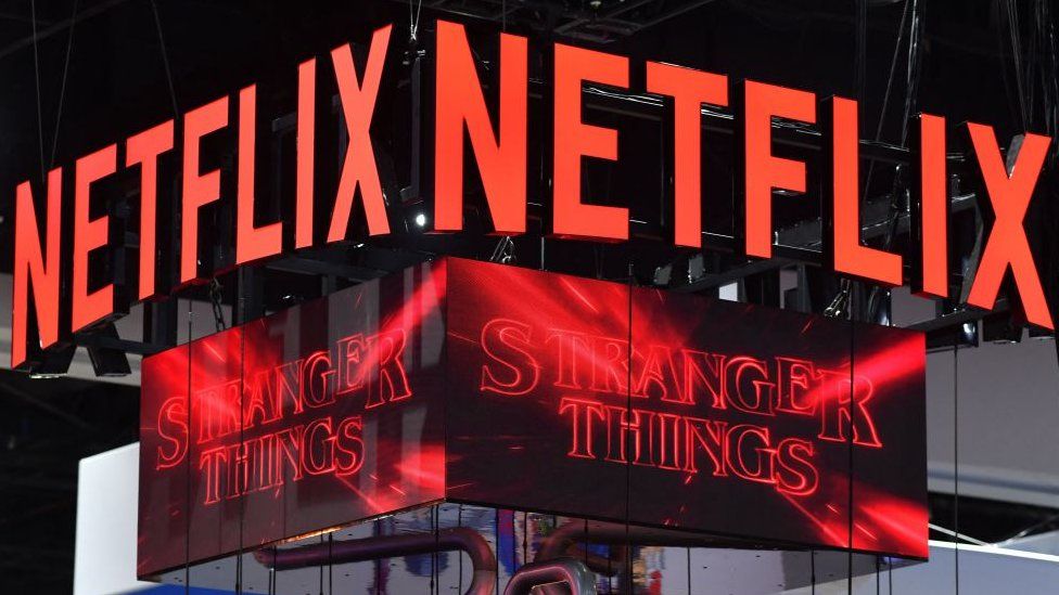 The Netflix booth advertises Stranger Things Season 4 on a screen during Comic-Con International in San Diego, California.