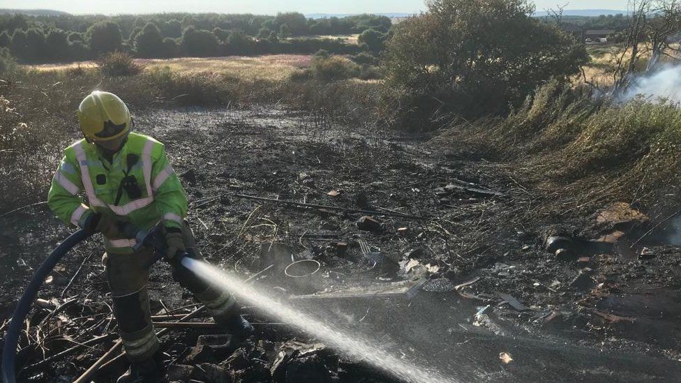 Firefighter at the scene of a wildfire in Easington Lane