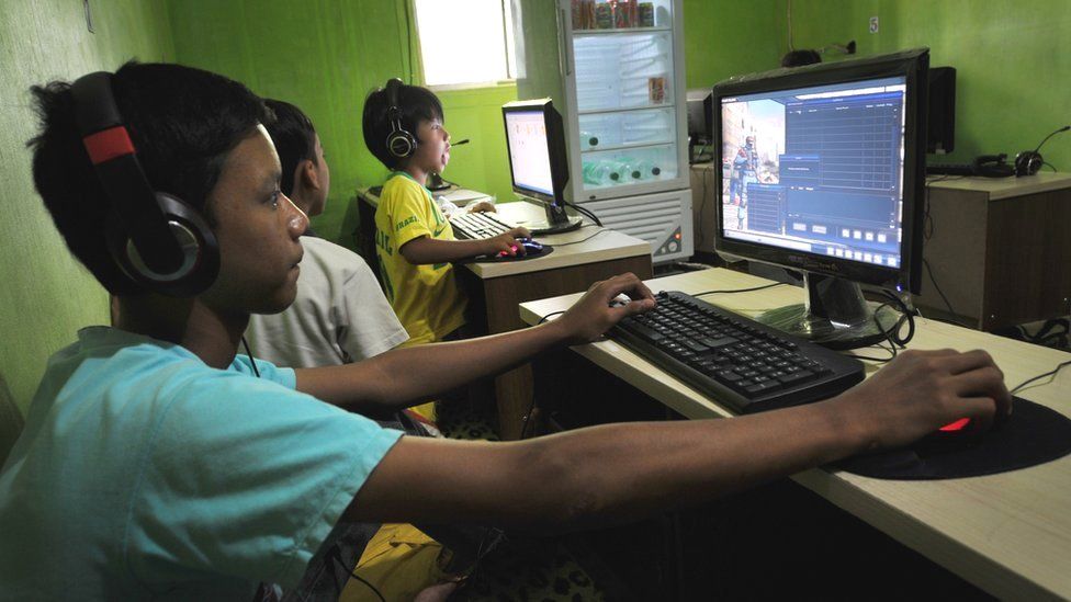Indonesian boys use computers at a public internet service in Jakarta (file image)