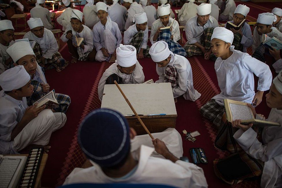 Malaysian religious students read the Koran at school during the Muslim holy fasting month of Ramadan in Hulu Langat, near Kuala Lumpur on 30 June 2014.