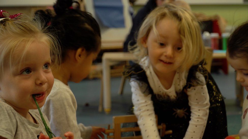 The two and three year olds enjoy playing and learning together