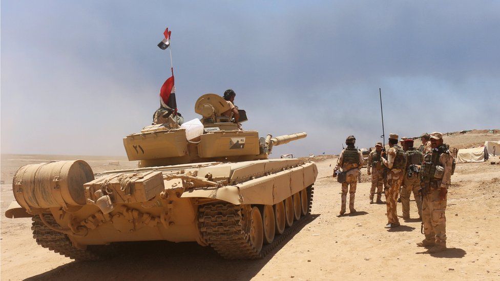 Iraqi soldiers gather to go battle against Islamic State militants south of Mosul on 15 June