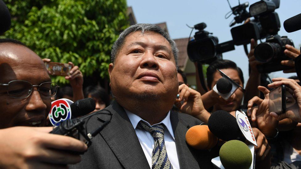 Premchai Karnasuta leaves the court after hearing the verdict against himself and three other suspects in a poaching case