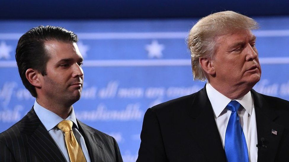 Donald Trump Jr. stands onstage with his father Donald Trump after presidential debate in Hempstead, New York on 26 September 2016
