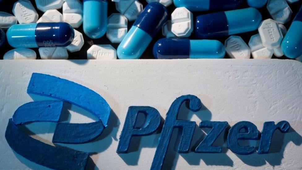 Pfizer logo and pills (file picture)