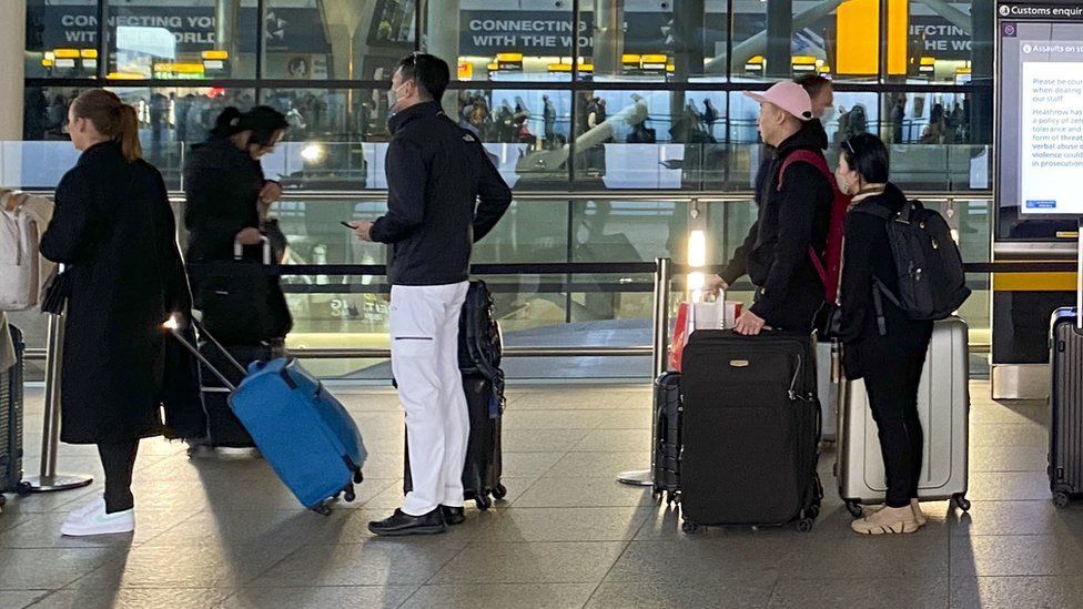 Passengers at Heathrow Airport on 9 April 2022