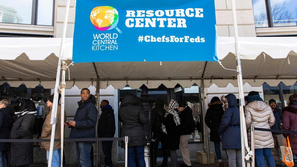 Federal employees wait in line at World Central Kitchen, a food bank and food distribution centre in Washington on January 25, 2019