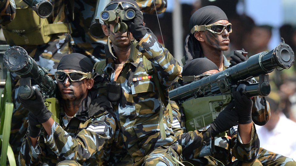 Sri Lankan army Special Force commando soldiers participate in a Victory Day parade in the southern town of Matara on May 18, 2014.
