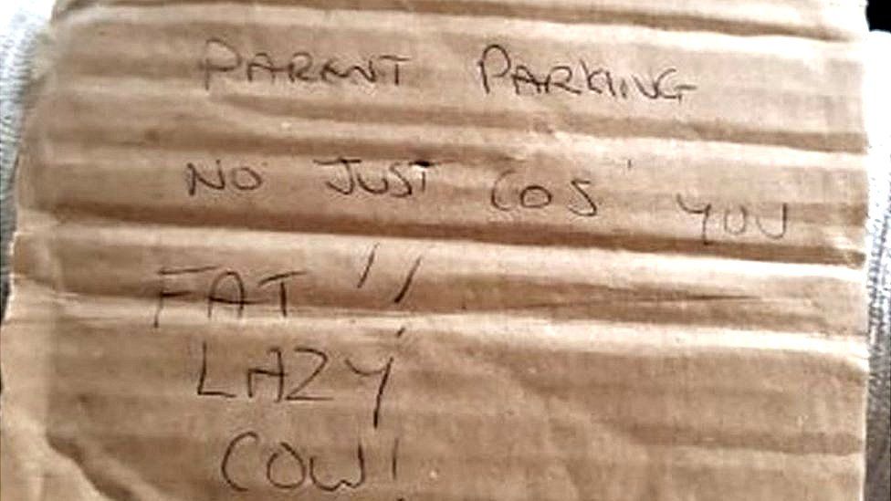 Parking note reading "parent parking, not just cos you're fat"