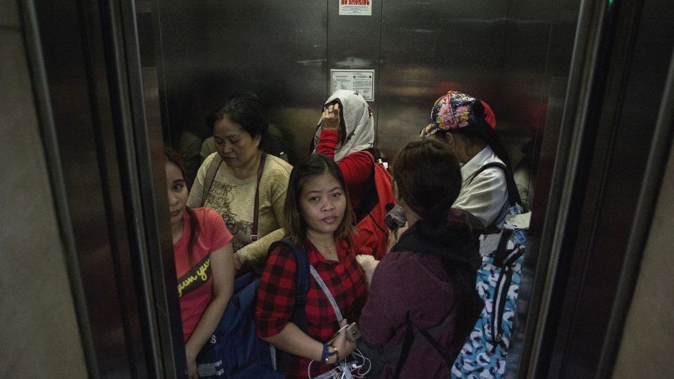 This photo taken on February 17, 2018 shows Filipina workers returning home from Kuwait