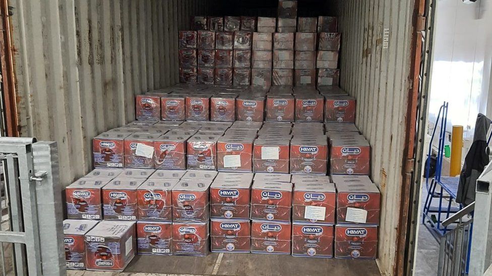 Boxes of juice in unit