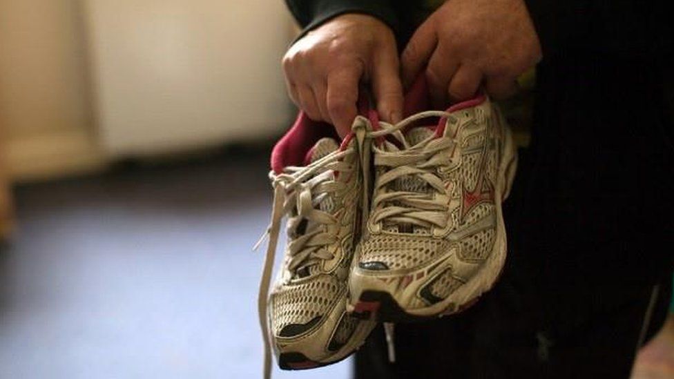 Man with trainers who was forced into labour