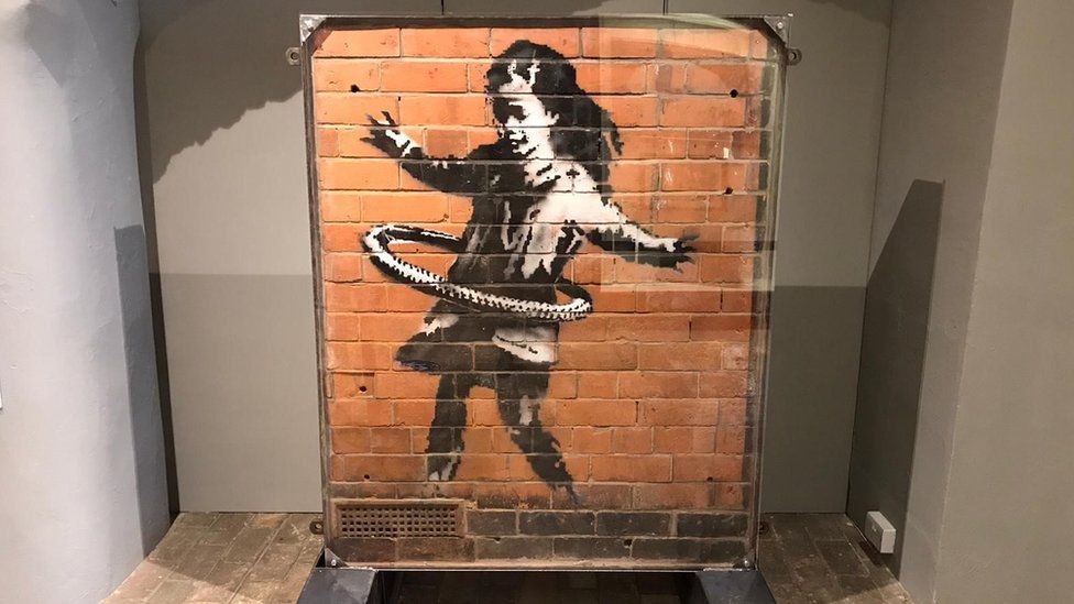 The installation of Banksy's hula-hooping girl at the Moyse's Hall Museum in Bury St Edmunds