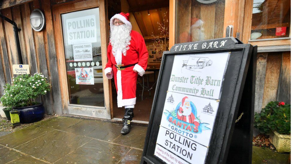 Man dressed as Father Christmas at polling station in Somerset
