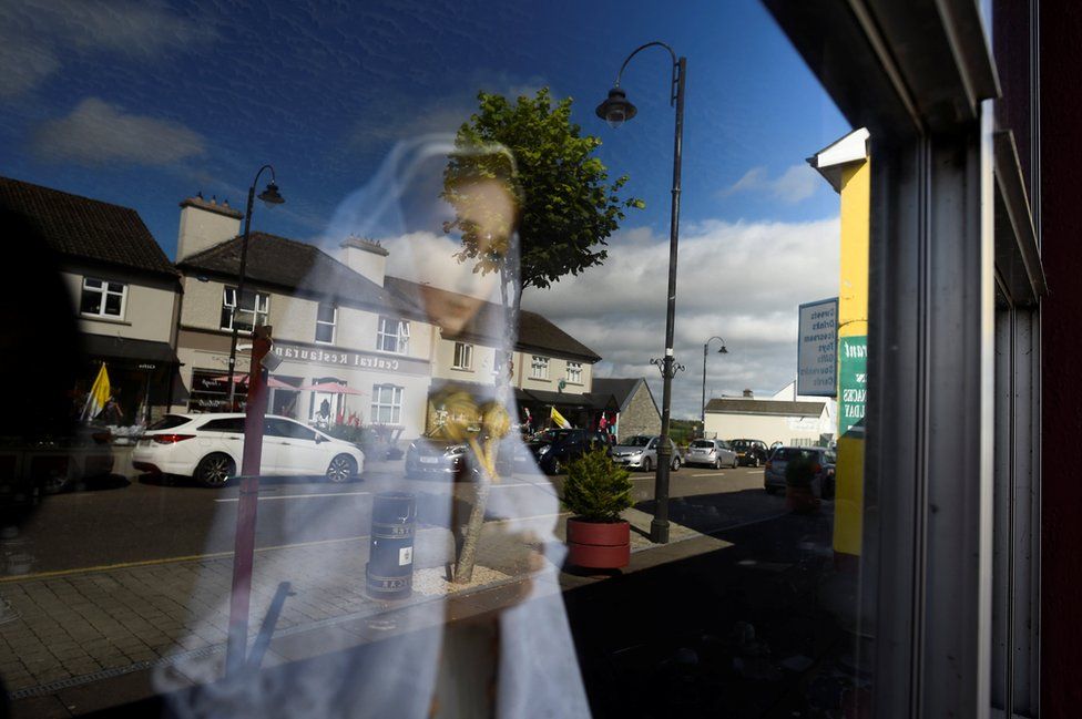 A statue of the Virgin Mary looks out from a shop at the National Marian Shrine town of Knock