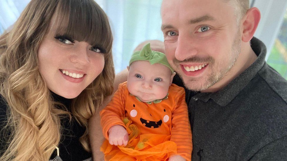 Demi-Louise Bailey with her partner and their baby girl Harper